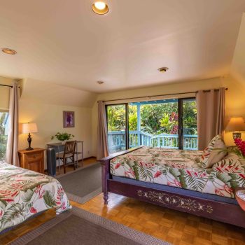 Garden Room: Side angle view shows king bed, twin bed and study table with entrance door in background
